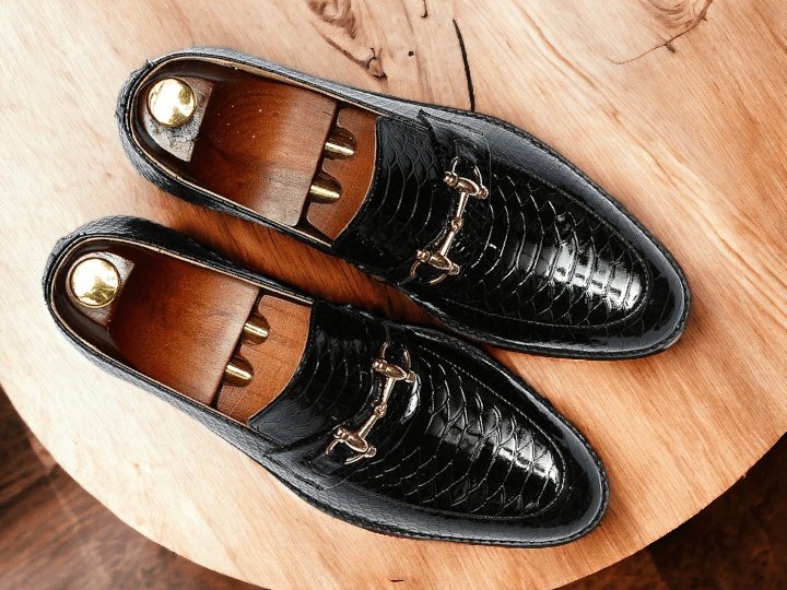 Expertly crafted, these Men's Black Python Leather Shoes exude sophistication and style. Handmade to perfection, they feature a classic Horse bit Style Loafer design, adding a touch of elegance to any outfit. Elevate your footwear game with these luxurious, statement pieces.