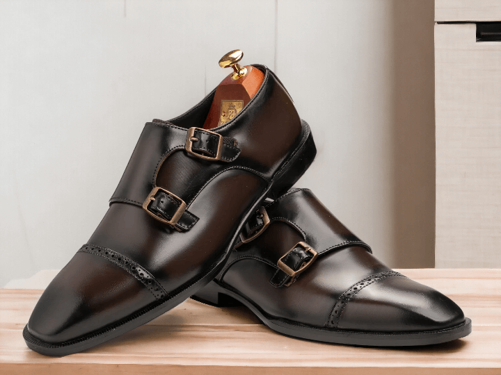 These Brown Monk Strap Shoes are the perfect combination of style and comfort. Made with high-quality black calf leather, they feature double monk straps for a sleek and sophisticated look. With sizes ranging from E to EEE, these shoes are available for every foot size. Elevate your wardrobe with these versatile and timeless shoes.