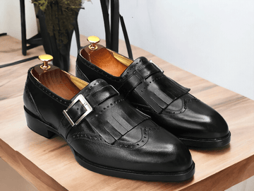 Crafted with precision and expertise, our Handmade Black Leather Monk Fringe Shoes elevate any outfit. Made with premium leather, these Men's Oxford Shoes showcase a unique monk fringe design for a touch of sophistication. Step out in style with these handcrafted shoes that offer both durability and unmatched style.