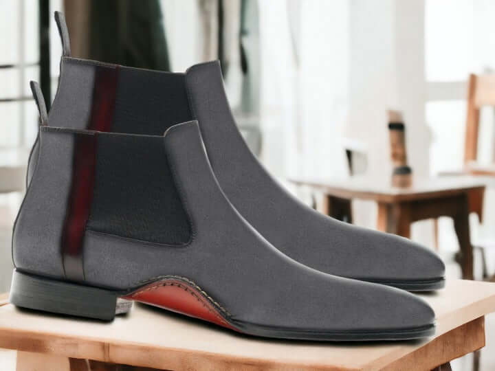 Elevate your formal style with our Bespoke Handmade Chelsea Boots. Crafted with premium suede and a Goodyear welt construction, these slip-on boots offer unparalleled comfort and durability. Perfect for any occasion, these ankle-high boots are a must-have for any stylish man.