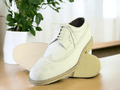 Expertly crafted from genuine leather, these handmade white Oxfords boast impeccable quality and timeless style. The intricate brogue and wing tip details add a touch of sophistication to any dress shoe collection. Elevate your professional look with these luxurious and durable shoes.