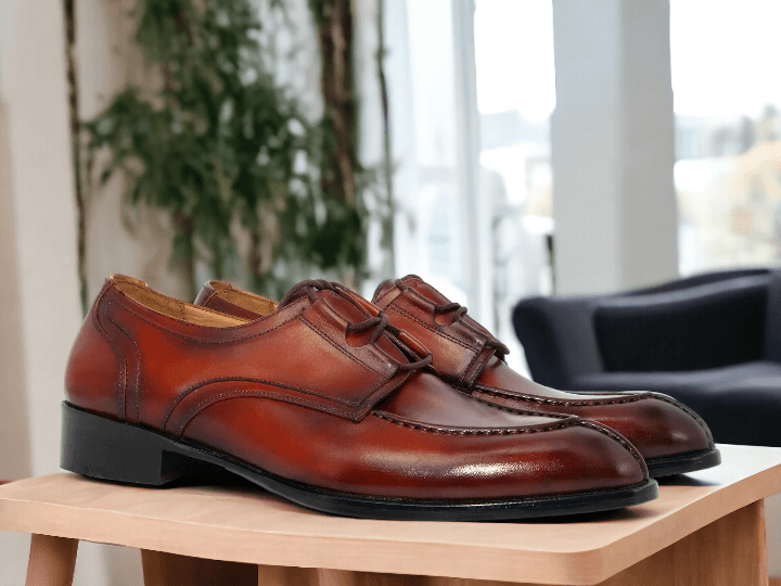 Experience timeless elegance with our Handmade Men's Burgundy Burnished Split Toe Shoes. These lace-up dress shoes are expertly crafted by hand, resulting in a stunning and stylish finish. With their unique split toe design and burnished detailing, these shoes are sure to elevate any outfit with a touch of sophistication.