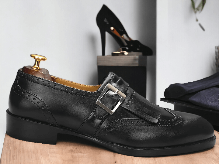 Crafted with precision and expertise, our Handmade Black Leather Monk Fringe Shoes elevate any outfit. Made with premium leather, these Men's Oxford Shoes showcase a unique monk fringe design for a touch of sophistication. Step out in style with these handcrafted shoes that offer both durability and unmatched style.