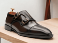 These Brown Monk Strap Shoes are the perfect combination of style and comfort. Made with high-quality black calf leather, they feature double monk straps for a sleek and sophisticated look. With sizes ranging from E to EEE, these shoes are available for every foot size. Elevate your wardrobe with these versatile and timeless shoes.