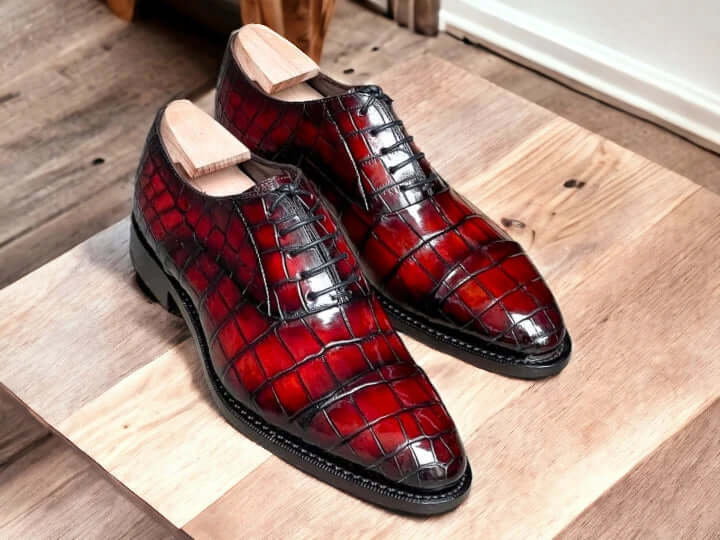 Experience sophistication and style with our New Stylish Burgundy Alligator Print Shoes. Handcrafted with high-quality materials, these shoes showcase an exquisite alligator texture that adds a touch of luxury to any outfit. Elevate your look and make a statement with these one-of-a-kind shoes.