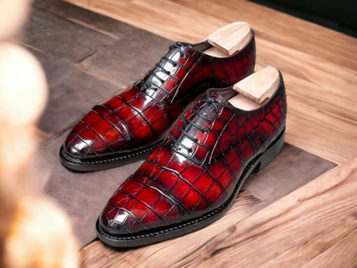 Experience sophistication and style with our New Stylish Burgundy Alligator Print Shoes. Handcrafted with high-quality materials, these shoes showcase an exquisite alligator texture that adds a touch of luxury to any outfit. Elevate your look and make a statement with these one-of-a-kind shoes.