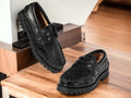 Expertly crafted with a sleek alligator print, these handmade black loafer shoes are sure to elevate any outfit. The chunky sole provides added comfort and style, while the slip on design makes them a convenient and versatile choice. Perfect for any occasion, these shoes are a must-have for any fashion-forward individual.