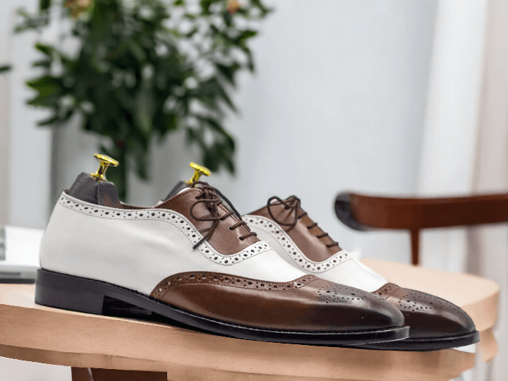 Expertly handcrafted, these Men White Brown Oxfords Wing Tip Shoes offer elegant sophistication with a touch of vintage charm. Made with superior quality materials, these brogue shoes provide both comfort and style. Elevate your wardrobe with these timeless and versatile shoes.