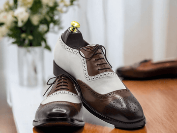 Expertly handcrafted, these Men White Brown Oxfords Wing Tip Shoes offer elegant sophistication with a touch of vintage charm. Made with superior quality materials, these brogue shoes provide both comfort and style. Elevate your wardrobe with these timeless and versatile shoes.