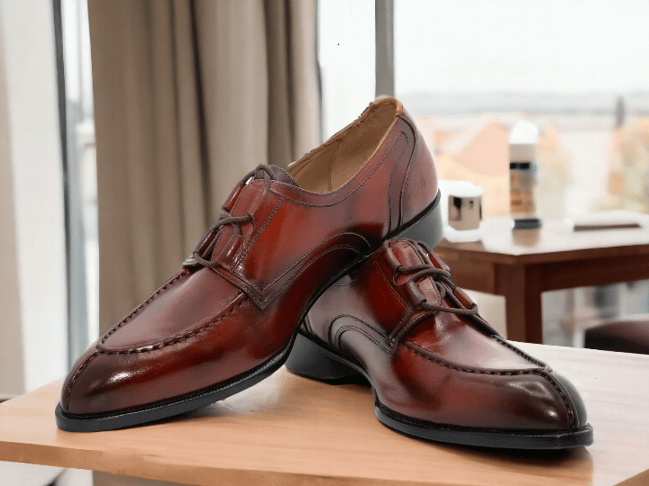 Experience timeless elegance with our Handmade Men's Burgundy Burnished Split Toe Shoes. These lace-up dress shoes are expertly crafted by hand, resulting in a stunning and stylish finish. With their unique split toe design and burnished detailing, these shoes are sure to elevate any outfit with a touch of sophistication.