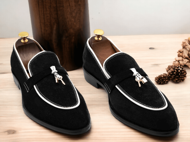 Upgrade your shoe game with our New Men's Black & White Suede Slip On Loafer Tussle Shoes. Crafted from high-quality suede, these shoes offer a comfortable and stylish fit. The perfect combination of classic black and trendy white, these shoes will elevate any outfit. Slip on and step up your style game today.