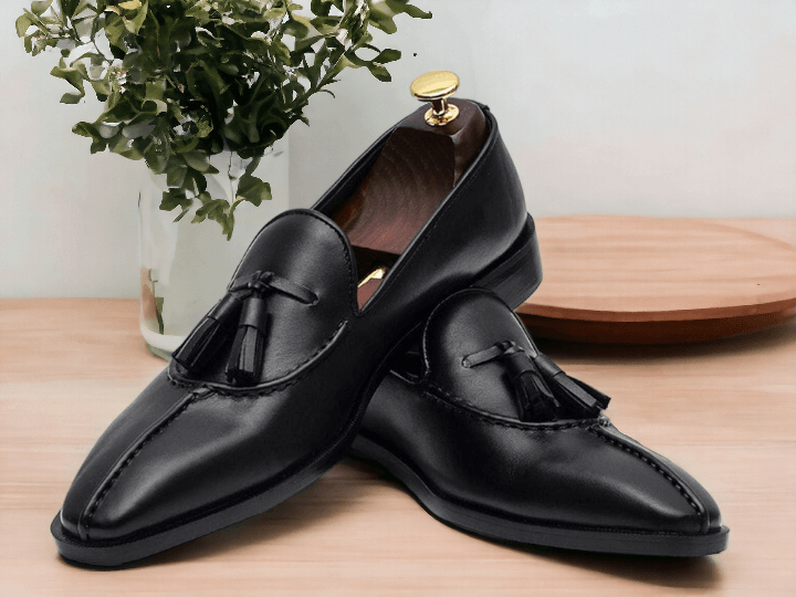 Handmade with premium black leather, these men's loafer dress shoes are the epitome of style and comfort. The meticulously crafted design ensures a perfect fit for any occasion. Experience the luxury and sophistication of these handmade shoes. Don't settle for anything less.