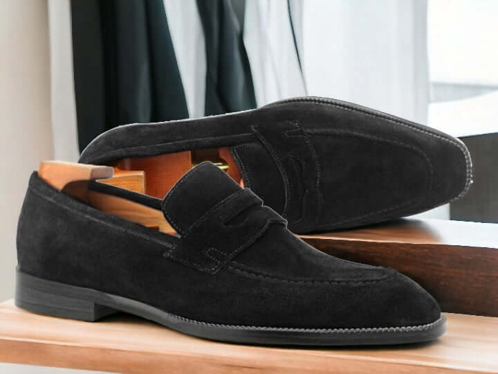 Expertly crafted from high-quality suede and featuring a subtle alligator pattern, these handmade penny loafers are the epitome of sophistication and style. The slip-on design offers effortless comfort and convenience, making them the perfect choice for any formal or casual occasion. Elevate your shoe collection with these timeless black suede penny loafers.