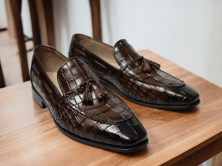 Indulge in luxury with our Handmade Men's Brown Alligator Print Shoes. These slip-on loafers with tussle detailing are meticulously crafted for a premium fit and style. Elevate your wardrobe and make a statement with these exclusive, handmade shoes.