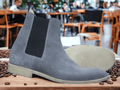 This Ankle High Grey Chelsea Suede Boot offers sophistication and style with its luxury design and hand painted finish. The high quality suede material is perfect for adding a fashionable touch to any look. Whether for work or a night out, this boot will be sure to make a statement.