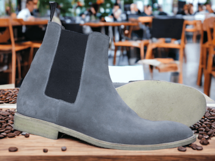 This Ankle High Grey Chelsea Suede Boot offers sophistication and style with its luxury design and hand painted finish. The high quality suede material is perfect for adding a fashionable touch to any look. Whether for work or a night out, this boot will be sure to make a statement.