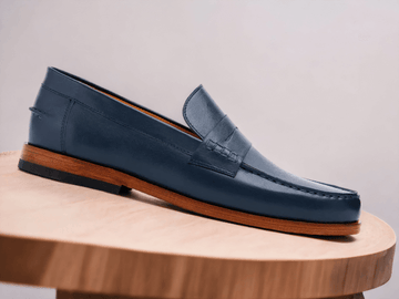 Step into style with these Blue Penny Loafer Shoes. Crafted with a sleek design and sturdy outsole, these shoes are the perfect balance of comfort and sophistication. The classic design makes them the perfect choice for any occasion.