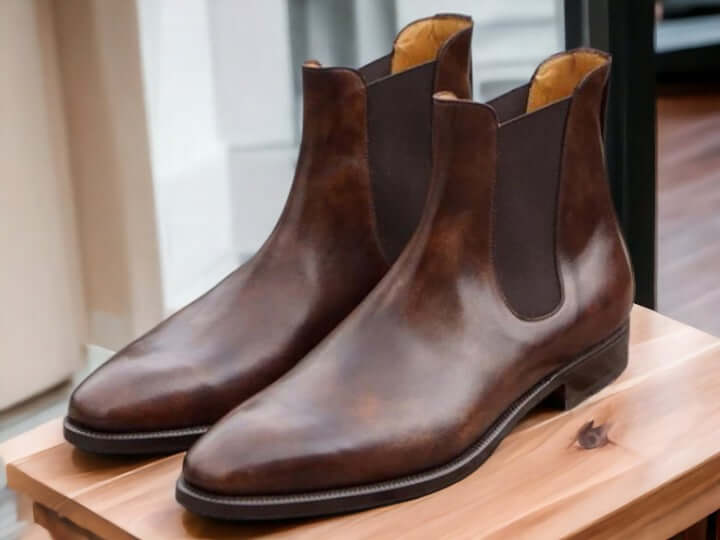 This men's leather boot is a true work of art, meticulously handcrafted using the finest tan Chelsea leather. The result is a luxurious and stylish choice that adds a touch of sophistication to your wardrobe. With its high ankle height, it's not only fashionable but also built for extra durability, making it a must-have addition for anyone with an eye for style.   