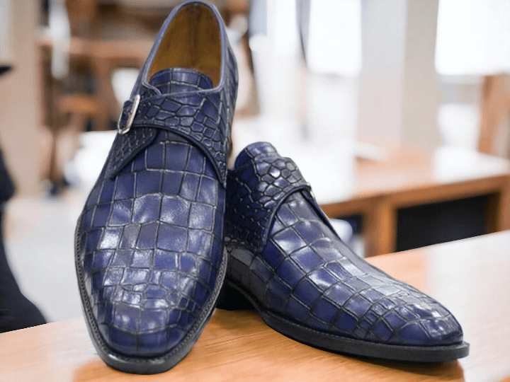 Indulge in luxury with our Handmade Blue Alligator Print Shoes for men. Made with the finest materials, these formal buckle shoes exude elegance and sophistication. Step out in style with our unique and stylish shoes, handcrafted to perfection. Elevate your look and make a statement with our alligator print shoes.