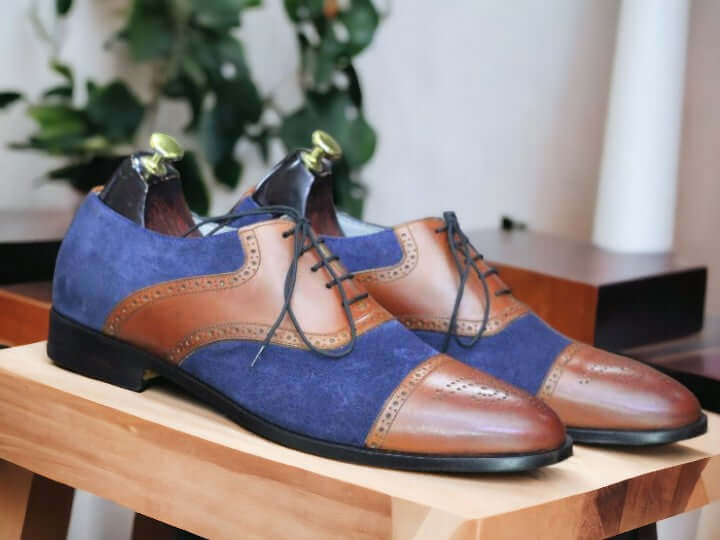 These Handmade Men's Suede & Leather Cap Toe Shoes offer a unique blend of craftsmanship and style. Two tone leather and suede details add sophistication, while the handmade design ensures quality and durability. Elevate your footwear collection with these timeless oxfords brogues.