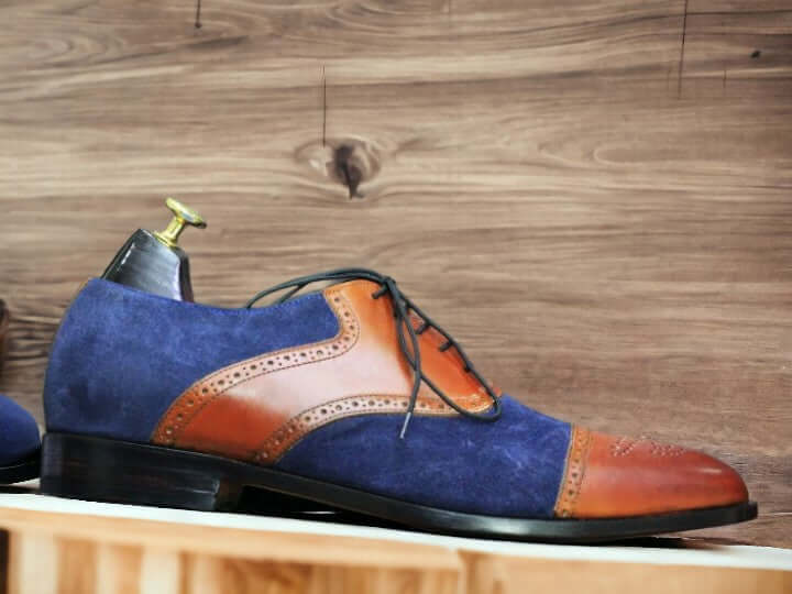 These Handmade Men's Suede & Leather Cap Toe Shoes offer a unique blend of craftsmanship and style. Two tone leather and suede details add sophistication, while the handmade design ensures quality and durability. Elevate your footwear collection with these timeless oxfords brogues.