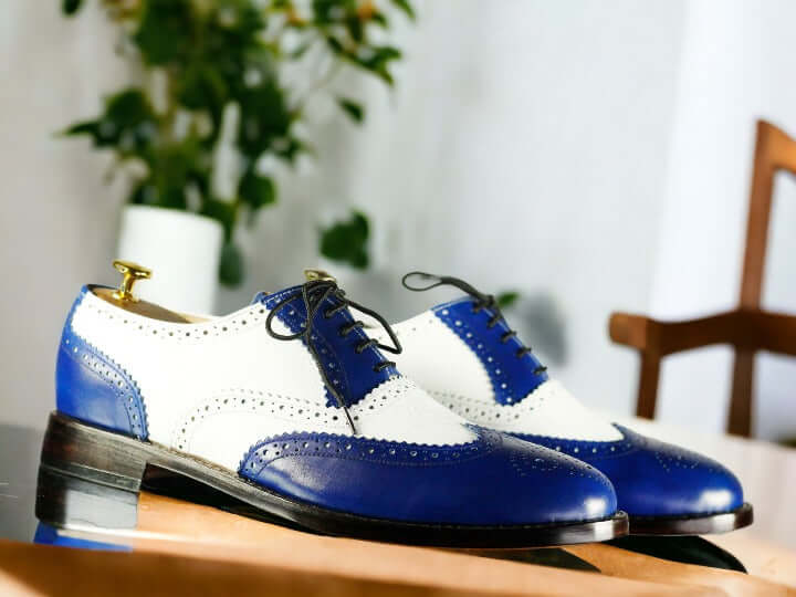 Make a fashionable statement with these Blue White Oxfords Shoes. These shoes are crafted with a classic Oxford design and feature a striking blue and white color palette. Perfect for any occasion, you'll be sure to stand out wearing these stylish shoes.