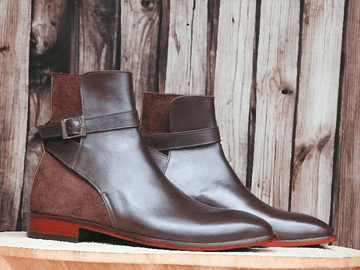 Expertly crafted by hand, these Men's Brown Leather &amp; Suede Jodhpurs Boots are the perfect blend of sophistication and durability. The high-quality leather and suede provide a comfortable fit, while the timeless design adds a touch of style to any outfit. Trust in the expert craftsmanship for long-lasting wear.