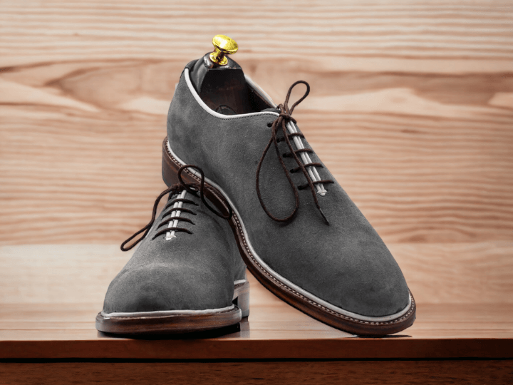 Expertly handcrafted using genuine suede leather, these men's grey suede oxford shoes exude refined elegance. With a whole cut design, these shoes offer a unique, seamless appearance that is sure to catch attention. Perfect for any formal event or workday, these shoes are a must-have for any gentleman's wardrobe.