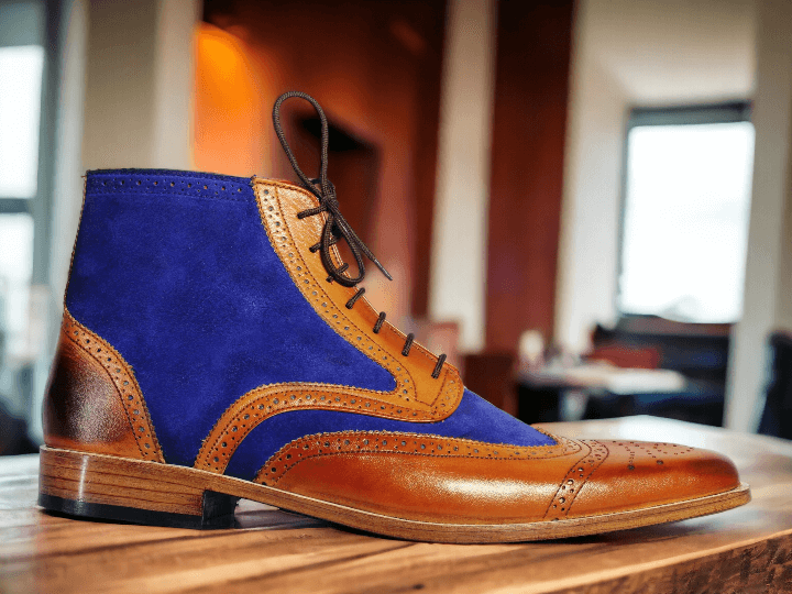 Expertly crafted for style and durability, these Men Tan Two Tone Leather Ankle Boots feature a unique hand painted design. Made from high quality leather, these boots offer both comfort and a touch of sophistication to any outfit. Elevate your shoe game with these one-of-a-kind boots.