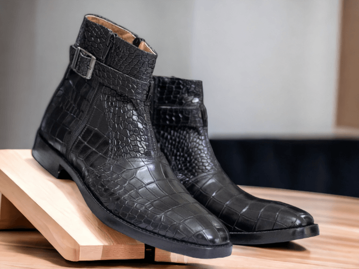 Expertly crafted with luxurious alligator leather, these handmade black boots are a sophisticated addition to any man's wardrobe. The convenient zipper closure ensures a secure fit, while the alligator leather showcases both style and quality. Elevate your look with these timeless boots.