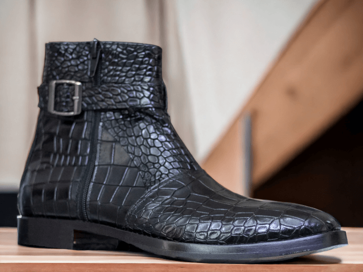 Expertly crafted with luxurious alligator leather, these handmade black boots are a sophisticated addition to any man's wardrobe. The convenient zipper closure ensures a secure fit, while the alligator leather showcases both style and quality. Elevate your look with these timeless boots.