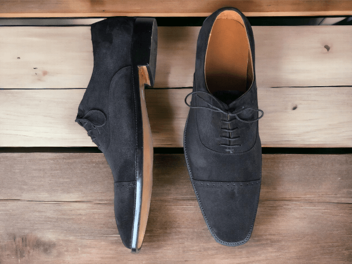 Expertly crafted with a black cap toe and suede material, these handmade lace up shoes are the epitome of formal elegance and style. With their superior quality and timeless design, they are perfect for any formal occasion and add sophistication to any outfit. Indulge in luxury and comfort with these men's dress shoes.