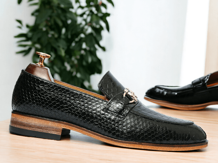 Expertly crafted, these Men's Black Python Leather Shoes exude sophistication and style. Handmade to perfection, they feature a classic Horse bit Style Loafer design, adding a touch of elegance to any outfit. Elevate your footwear game with these luxurious, statement pieces.