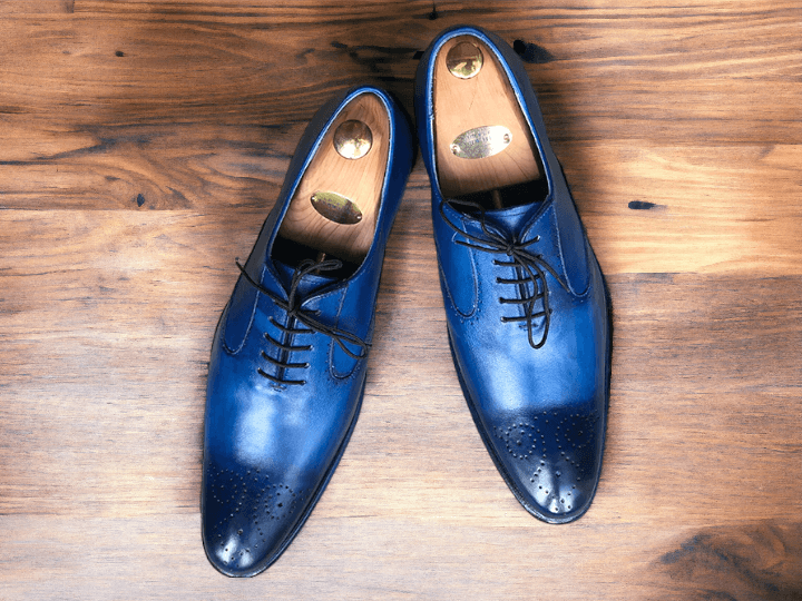 Expertly crafted for the modern gentleman, our Men Blue Office Shoes are the perfect combination of style and functionality. Made from premium Navy Oxfords leather and meticulously handmade, these luxury shoes will elevate your office wardrobe while providing all-day comfort. Step into success with our Men Blue Office Shoes.