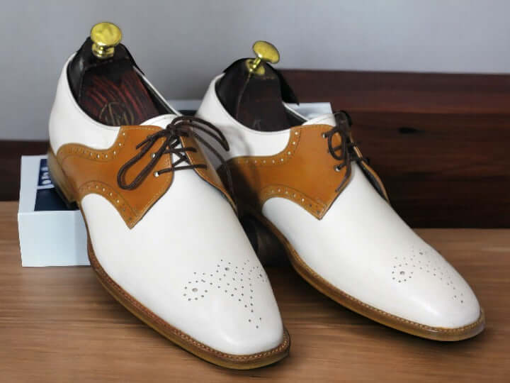 Expertly crafted for the modern man, these Handmade Men's Brown White Brogue Toe Lace Up Office Shoes exude sophistication and style. Handmade with care, these shoes feature a classic brogue toe design and lace up closure for a timeless look. Elevate your office attire with these high-quality shoes.