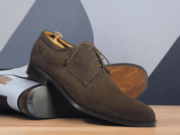 Expertly handcrafted, these chocolate brown lace-up shoes will elevate any outfit. Made with premium suede, these designer shoes offer a sleek and sophisticated look. Perfect for any occasion, their timeless design guarantees both style and comfort. Step up your shoe game with these exquisite handmade men's shoes.