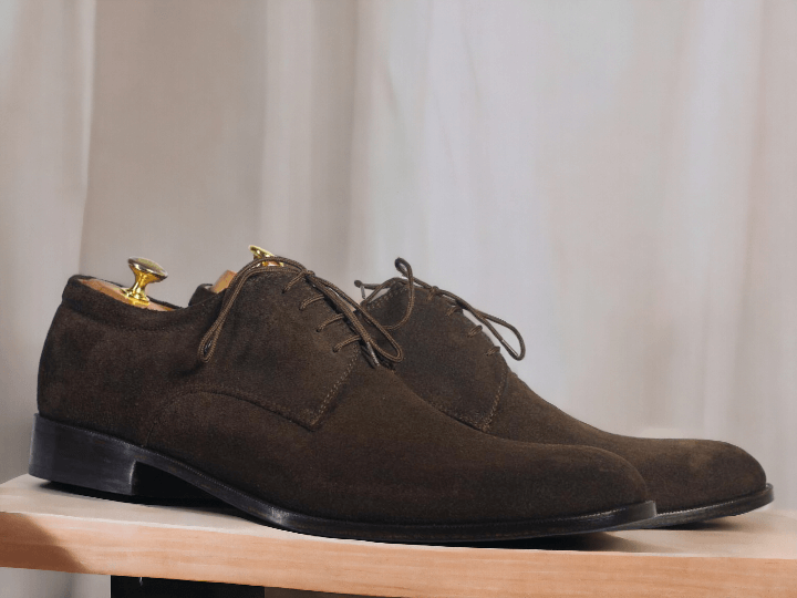 Expertly handcrafted, these chocolate brown lace-up shoes will elevate any outfit. Made with premium suede, these designer shoes offer a sleek and sophisticated look. Perfect for any occasion, their timeless design guarantees both style and comfort. Step up your shoe game with these exquisite handmade men's shoes.