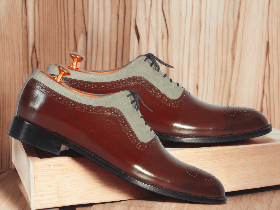 Expertly crafted from premium gray suede and accented with burgundy leather, these handmade wing tip brogue shoes are the epitome of luxury and style. A must-have for any stylish man, these designer shoes offer unmatched quality and sophistication. Elevate your wardrobe with these unique and timeless shoes.