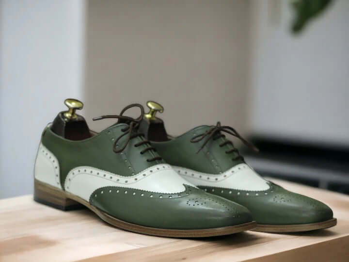 Expertly crafted by hand, these Men's Green White Dress Shoes are the perfect combination of style and quality. Made with precision and attention to detail, the designer Brogue Oxfords offer a unique and sophisticated look for any occasion. Elevate your wardrobe with these handmade shoes.