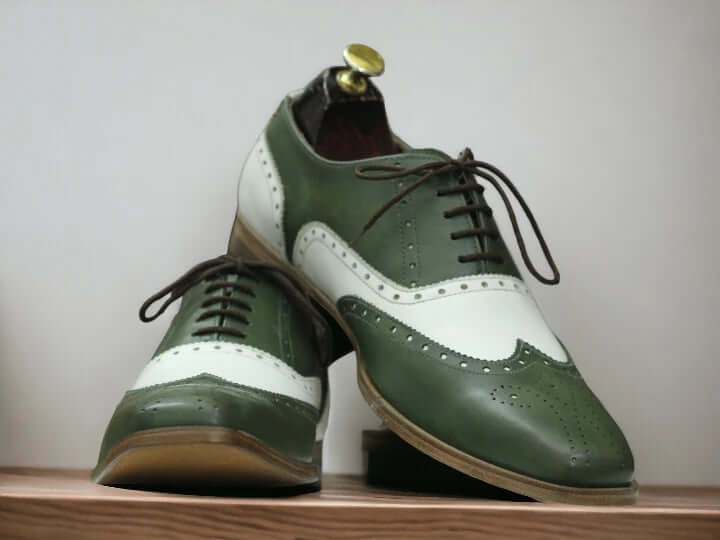 Expertly crafted by hand, these Men's Green White Dress Shoes are the perfect combination of style and quality. Made with precision and attention to detail, the designer Brogue Oxfords offer a unique and sophisticated look for any occasion. Elevate your wardrobe with these handmade shoes.