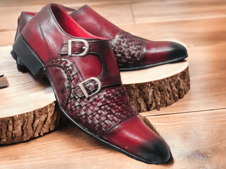 Expertly handcrafted from premium leather, these Double Monk Woven Burgundy Shoes add a touch of sophistication to any outfit. The intricate weaving detail and double monk strap design elevate the classic shoe, making it a versatile piece for any occasion. Step out in style with these high-quality, handmade shoes.