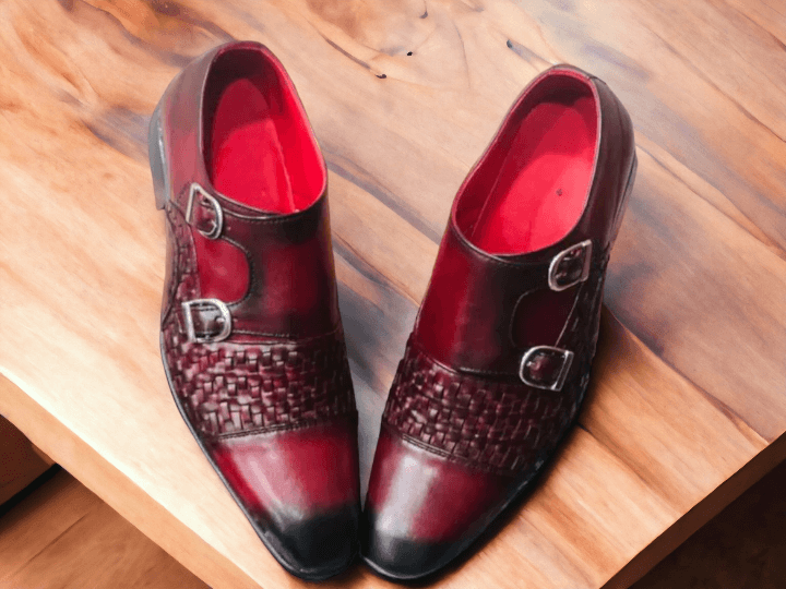 Expertly handcrafted from premium leather, these Double Monk Woven Burgundy Shoes add a touch of sophistication to any outfit. The intricate weaving detail and double monk strap design elevate the classic shoe, making it a versatile piece for any occasion. Step out in style with these high-quality, handmade shoes.