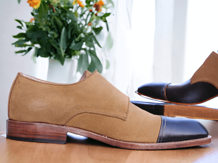 Elevate your style with our Handmade Men's Leather Suede Cap Toe Shoes. Crafted with precision and detail, these shoes offer a touch of luxury and sophistication. The double monk strap adds a sleek, modern touch to your ensemble. Available in classic black or trendy tan, perfect for any occasion.