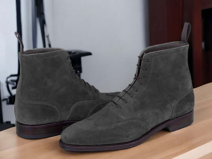 Expertly crafted and designed for the modern man, these handmade navy suede ankle boots are the perfect fusion of style and functionality. Made from high-quality leather and suede, these ankle high boots offer both classic and fashion-forward elements. Elevate your look and step out confidently in these versatile and stylish boots.