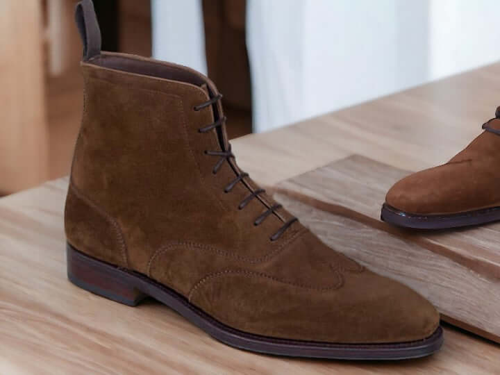 Expertly crafted and designed for the modern man, these handmade navy suede ankle boots are the perfect fusion of style and functionality. Made from high-quality leather and suede, these ankle high boots offer both classic and fashion-forward elements. Elevate your look and step out confidently in these versatile and stylish boots.