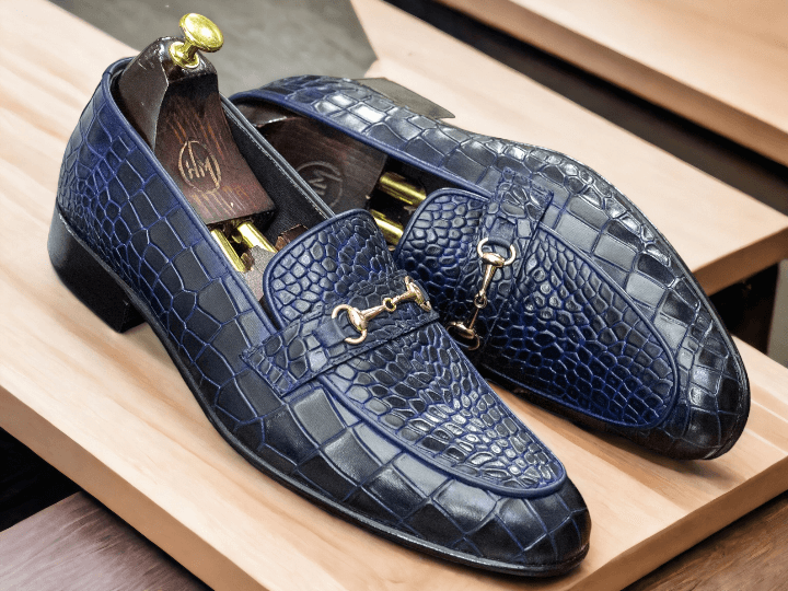 Introducing our Handmade Alligator Penny Loafer, the perfect combination of luxury and craftsmanship. Each pair is meticulously crafted by hand using genuine alligator leather, ensuring unparalleled quality and durability. Elevate your style and step into luxury with our exclusive loafer.