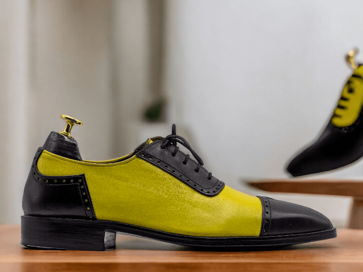 Expertly crafted for a sleek and stylish look, our bespoke Men Yellow Black Oxfords are perfect for formal occasions. The two tone color leather, combined with the lace up design, provides both comfort and sophistication. Elevate your wardrobe with these handcrafted, one-of-a-kind shoes.