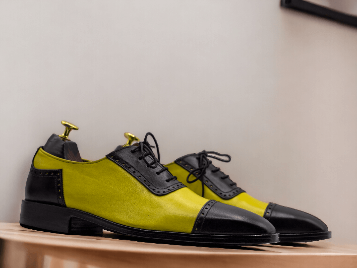 Expertly crafted for a sleek and stylish look, our bespoke Men Yellow Black Oxfords are perfect for formal occasions. The two tone color leather, combined with the lace up design, provides both comfort and sophistication. Elevate your wardrobe with these handcrafted, one-of-a-kind shoes.