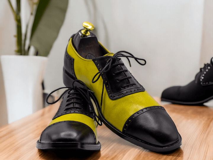 Expertly crafted for a sleek and stylish look, our bespoke Men Yellow Black Oxfords are perfect for formal occasions. The two tone color leather, combined with the lace up design, provides both comfort and sophistication. Elevate your wardrobe with these handcrafted, one-of-a-kind shoes.