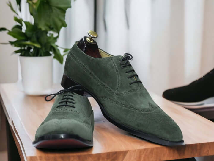 Elevate your style with our Handmade Green Suede Shoes. Crafted with attention to detail, our Wing Tip Shoes feature a classic lace-up design for a polished look. Perfect for any occasion, these shoes are not only stylish but also handcrafted for durability and comfort.